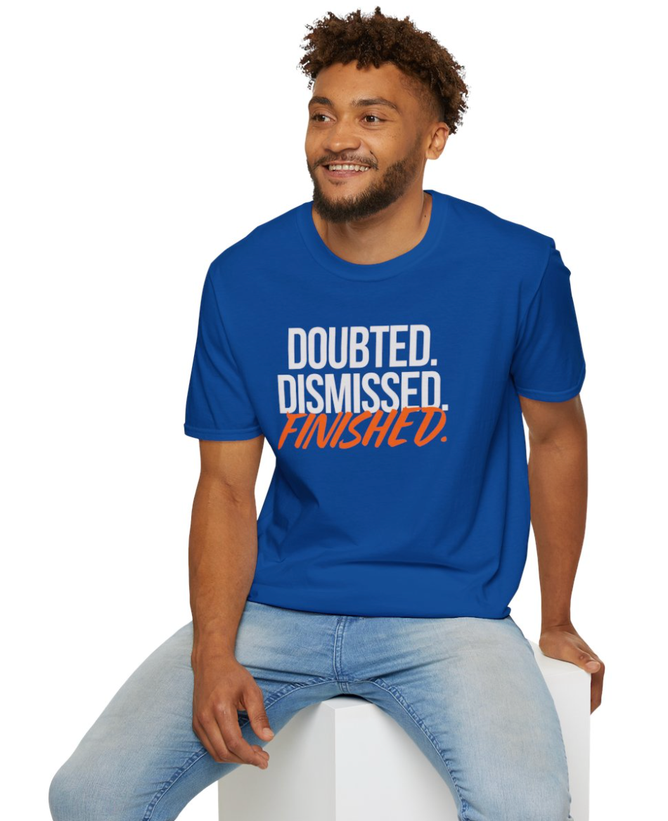 Man wearing a blue t-shirt with text 'Doubted, Dismissed, Finished.' on a white background